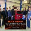 ACC Auto Tech students in ACC auto shop at the Littleton Campus with Battery Workforce Challenge logo