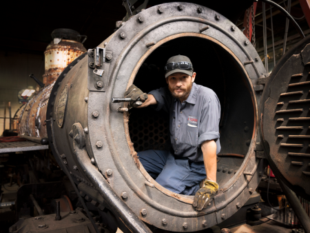 photo of man / worker in a pipe by Nate Bridges