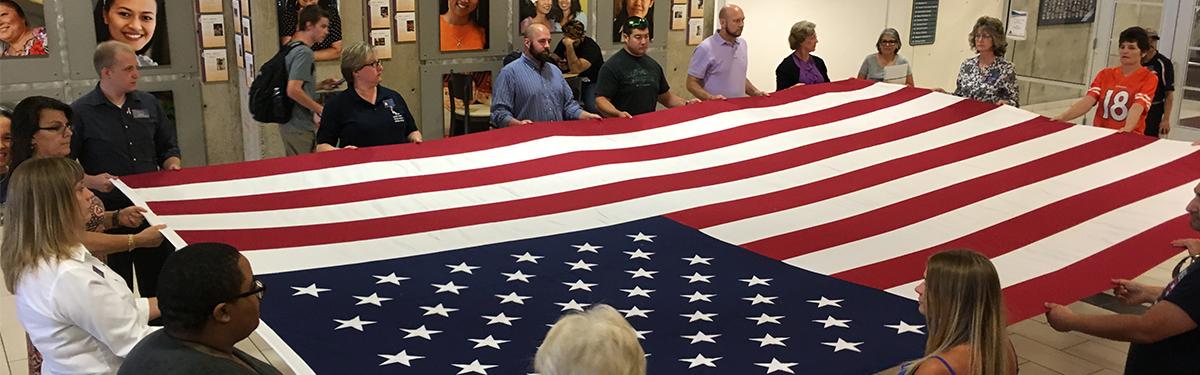 Veterans Club folding the American Flag