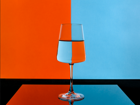 photo of glass of water with orange and blue background by Peter Loyd Vuolo