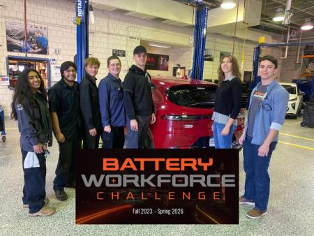 ACC Auto Tech students in ACC auto shop at the Littleton Campus with Battery Workforce Challenge logo