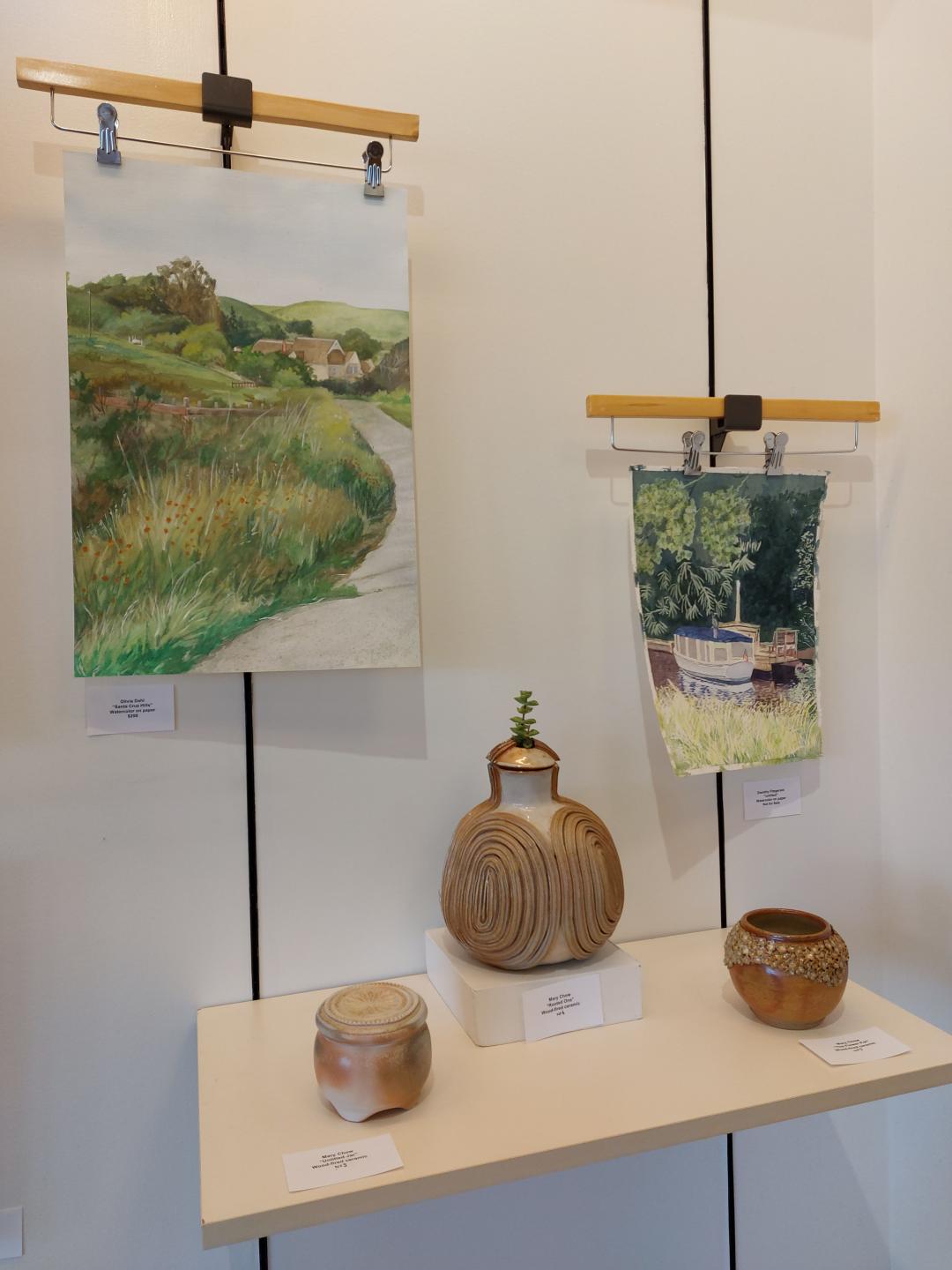 Ceramics and paintings made by ACC students on display at Aspen Grove in Littleton, Colorado.