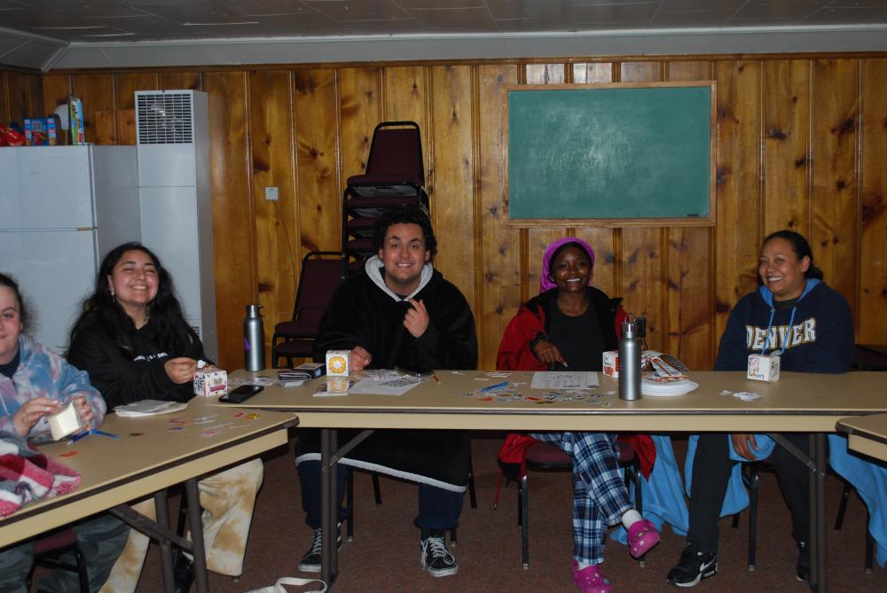 ACC TRIO SSS students participating in a community building activity in a cabin in Estes Park.