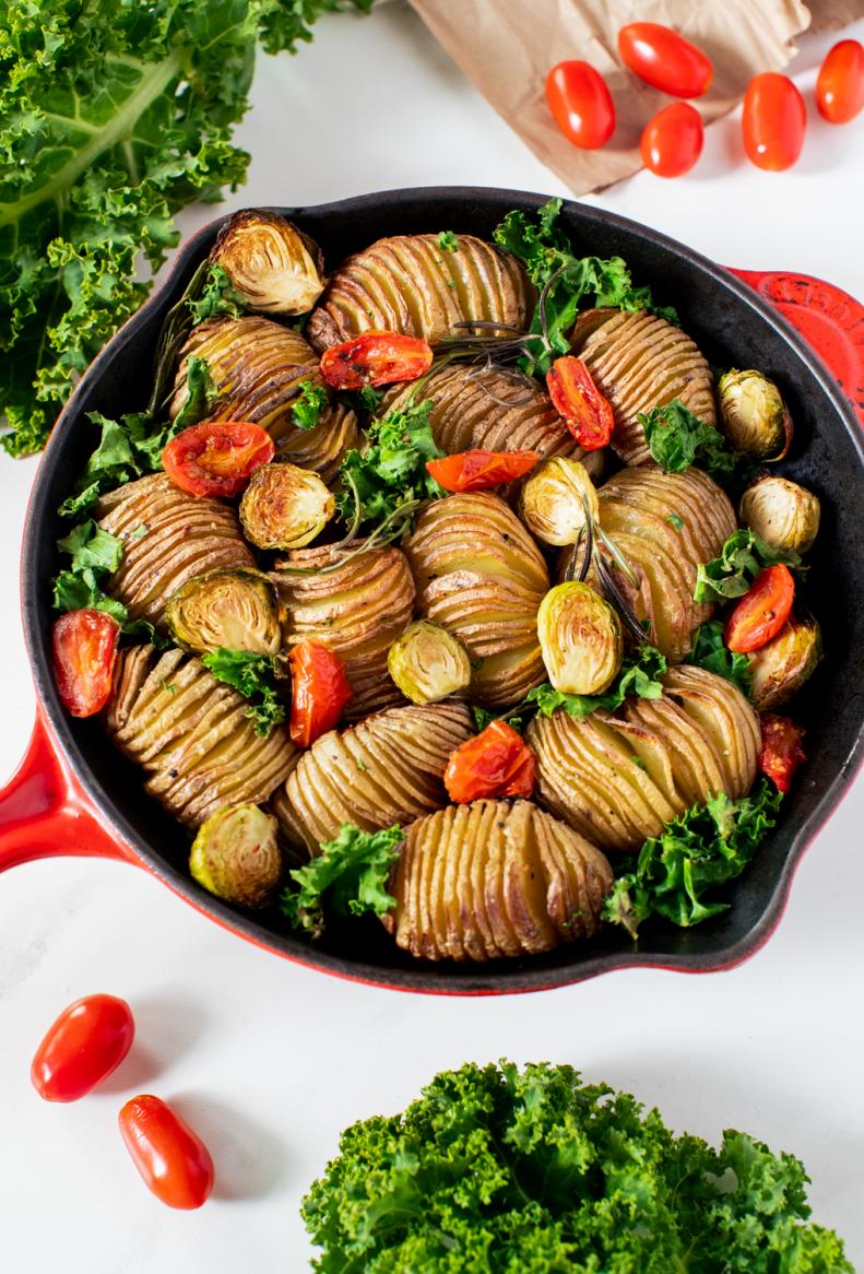 photo of pan of potatoes, brussel sprouts, and tomatoes by Kate Blakeman