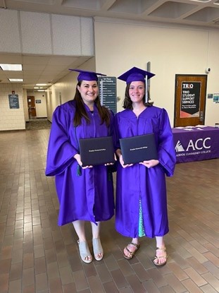 2 ACC Medical Assistant program graduates in regalia at ACC's Commencement Ceremony at the Littleton Campus.
