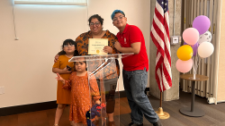 Erika Animas and kids at graduation ceremony.