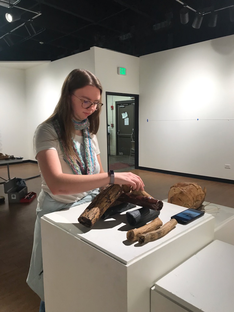 An ACC student sets up a tactile art display at the Colorado Gallery of the Arts for the "Shared Visions" exhibition.