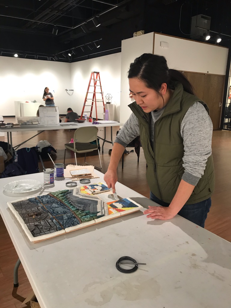 ACC student completing tactile art project for display at the Colorado Gallery of the Arts.