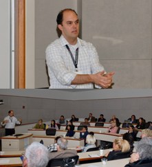 John Ameen teaching in a classroom full of teenagers