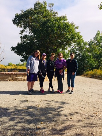 Kylie Ribble, Karen Browning, Kateryna Hairston, Zhannat Ishmuradova, and Katrina Lenk take a break from pulling weeds on a beautiful Friday in September at Denver Audubon’s Nature Center adjoining Chatfield State Park. 