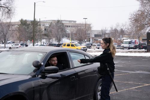 ACC LEA student simulating traffic violation encounter with another LEA student in vehicle.