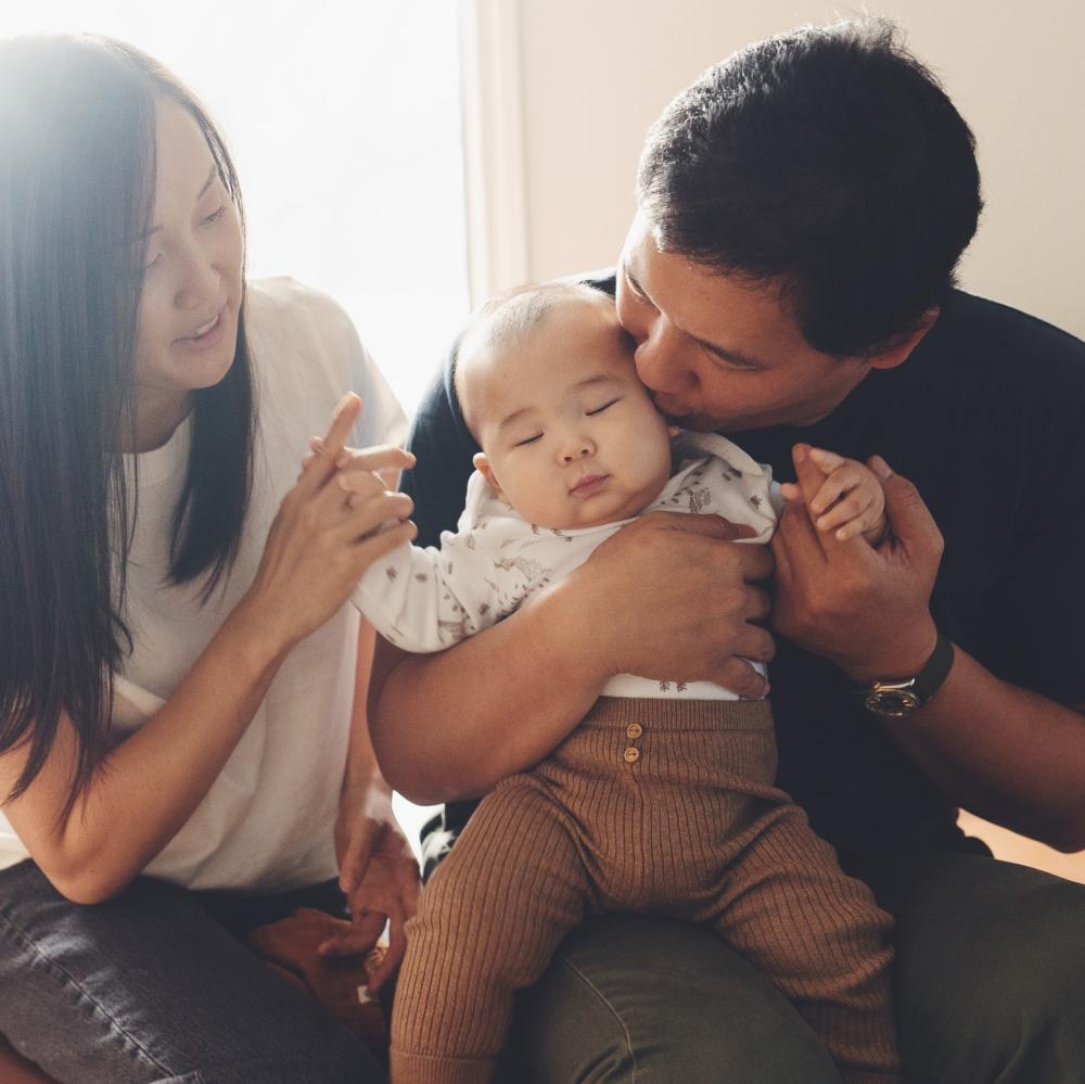 Portrait of parents with their baby.