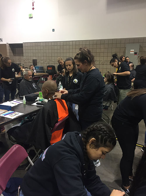 ACC Cosmetology students giving haircuts at Project Homeless Connect 2019