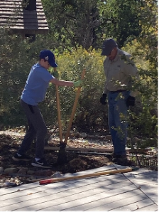 Younger volunteers worked together with Denver Audubon volunteers to learn how to dig holes for new signs to be placed along the Nature Center’s trails.