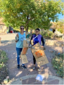 Denver Audubon volunteers with boxes stop to pose for picture.