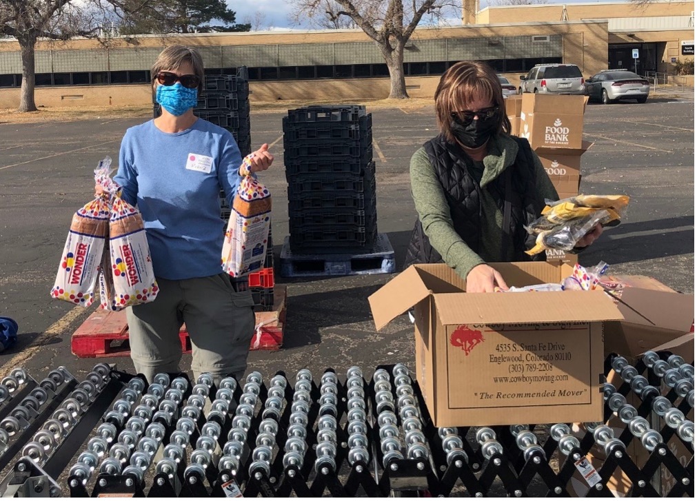 Diana Hornick and Kristi Doherty helped fill boxes of fresh produce, dry and canned foods, bread, and $20 gift cards.