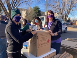 Faculty Director for the Center for Professional Development Megan Rector and her sister Andrea began the morning-long process by assembling 500 boxes.