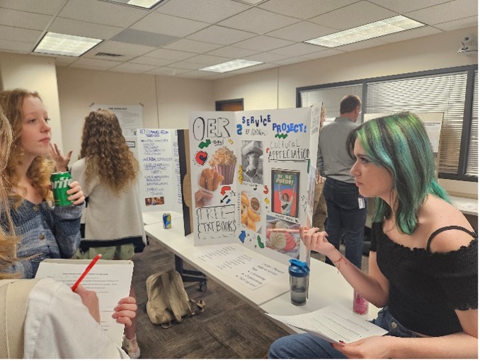 Students and staff at the Service Learning Poster Session at ACC's Littleton Campus. 