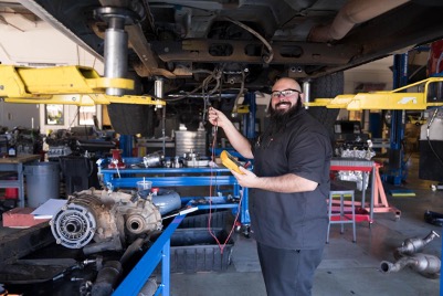 Ryan Wade, ACC Automotive Technology student working in the auto lab at ACC's Littleton Campus.