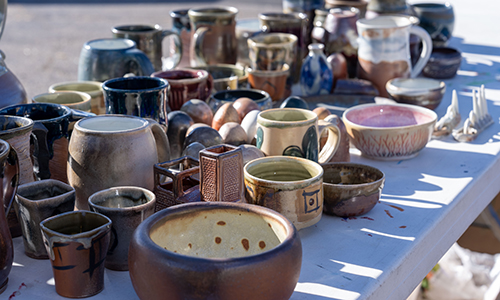 pottery unloaded from ACC's kiln on a table