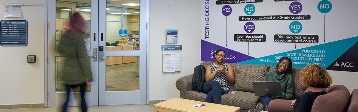 ACC students sitting outside of the Testing Center at the Littleton Campus.