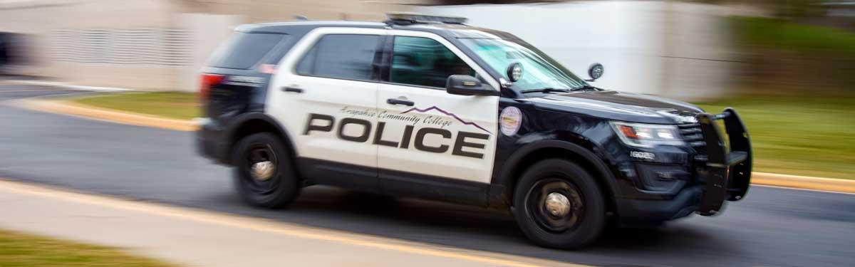 Arapahoe Community College campus police vehicle outside of the Littleton Campus main building.