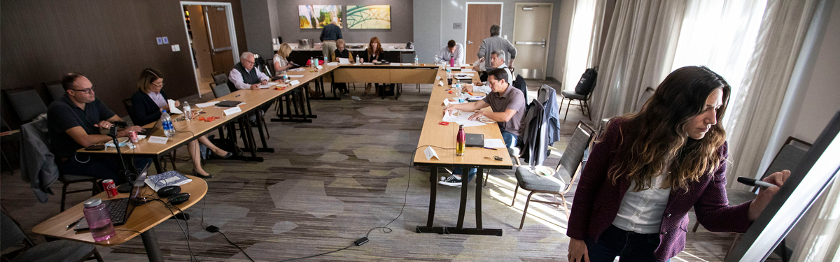 ACC Board of Directors seated in a classroom during a working retreat.