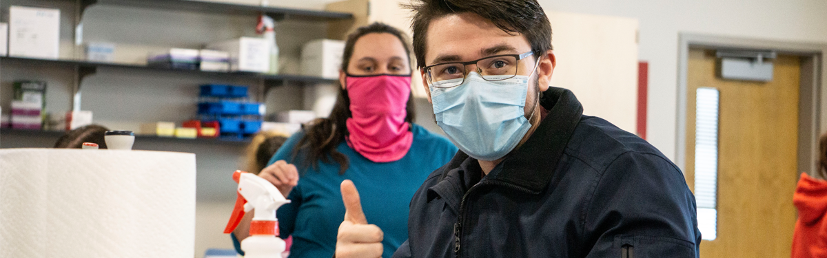 ACC student at Sturm Collaboration Campus giving the thumbs up in science class.
