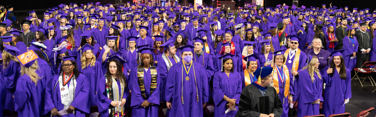 ACC graduates in regalia at Commencement.