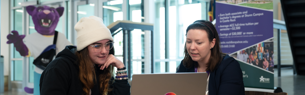 ACC Navigator assisting a student at the Sturm Collaboration Campus at Castle Rock. 