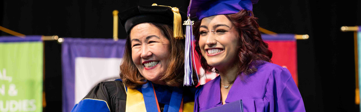 ACC President Stephanie J. Fujii, PhD, with an ACC graduate at commencement.