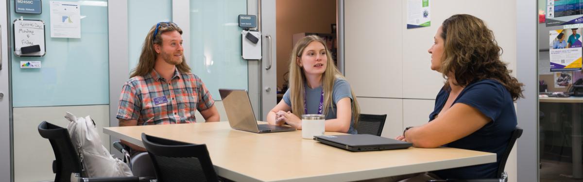 Career advisors speaking with students at ACC's Littleton Campus.