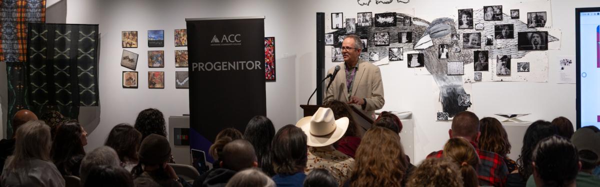 ACC Progenitor Release Party - John Hall speaking at the front of the room