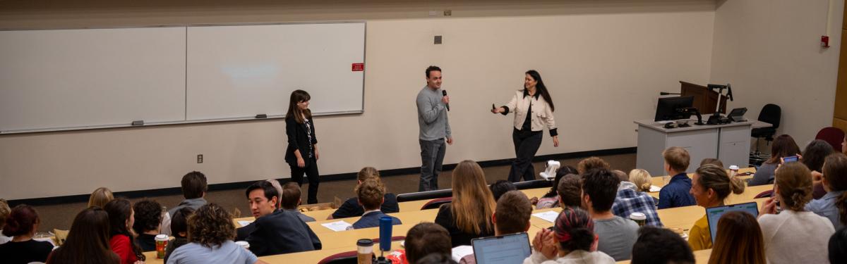 ACC undergrad research students presenting in the lecture hall during the Fall Research Symposium