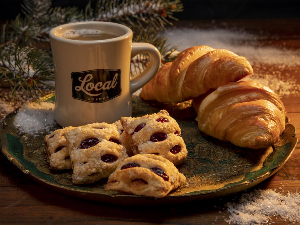 Photo of coffee cup and pastries on a plate - photo by Mercedes Gania