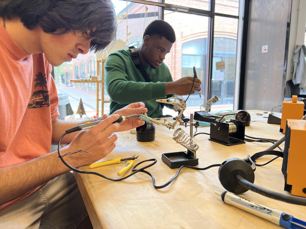 ACC students in the HIVE MakerSpace working on projects.