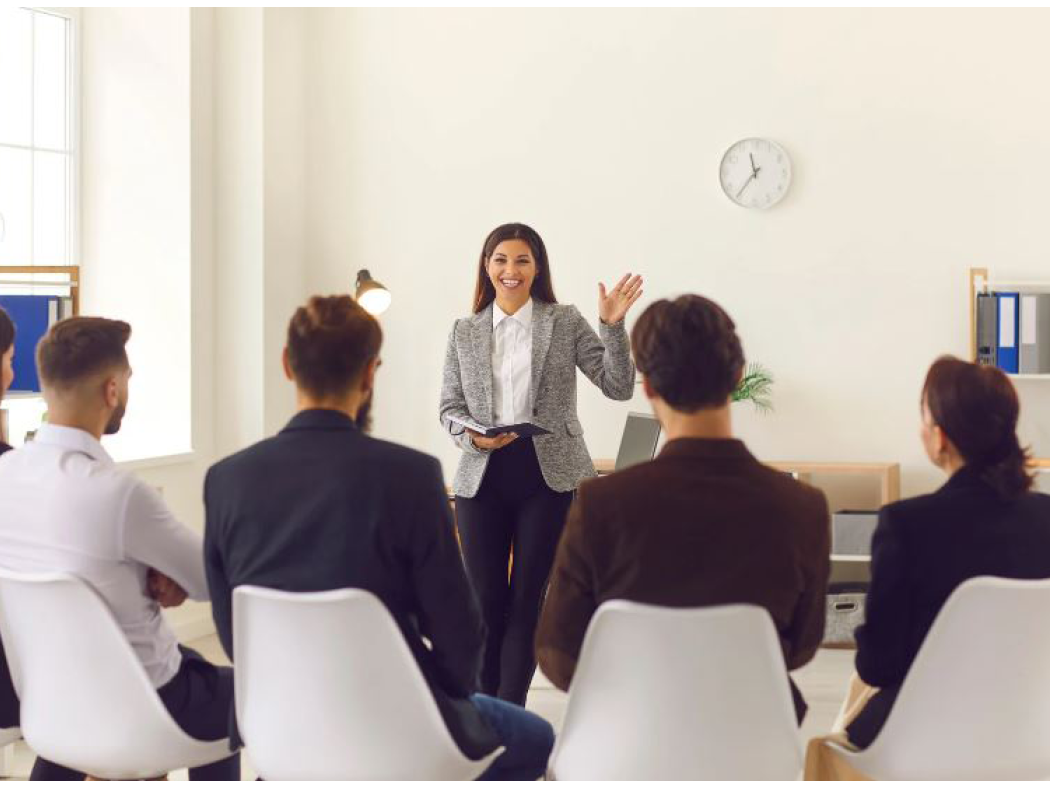 Woman leading a meeting of business people.