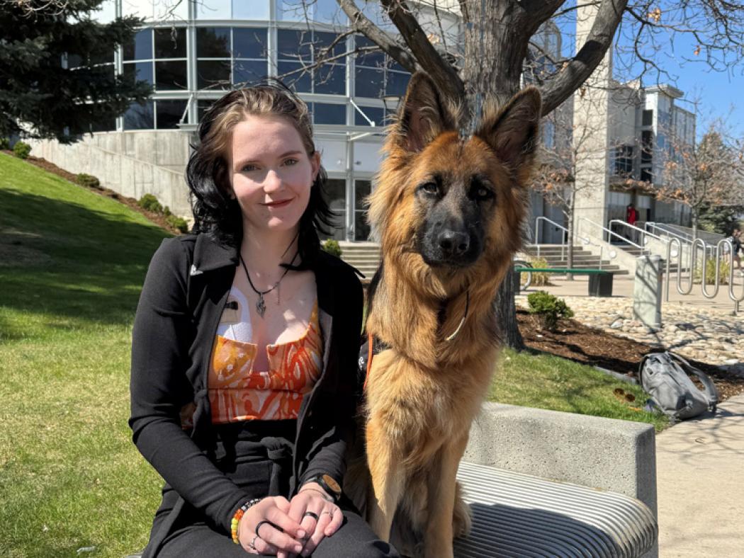 Ripley with their cardiac alert service dog, Rêve.