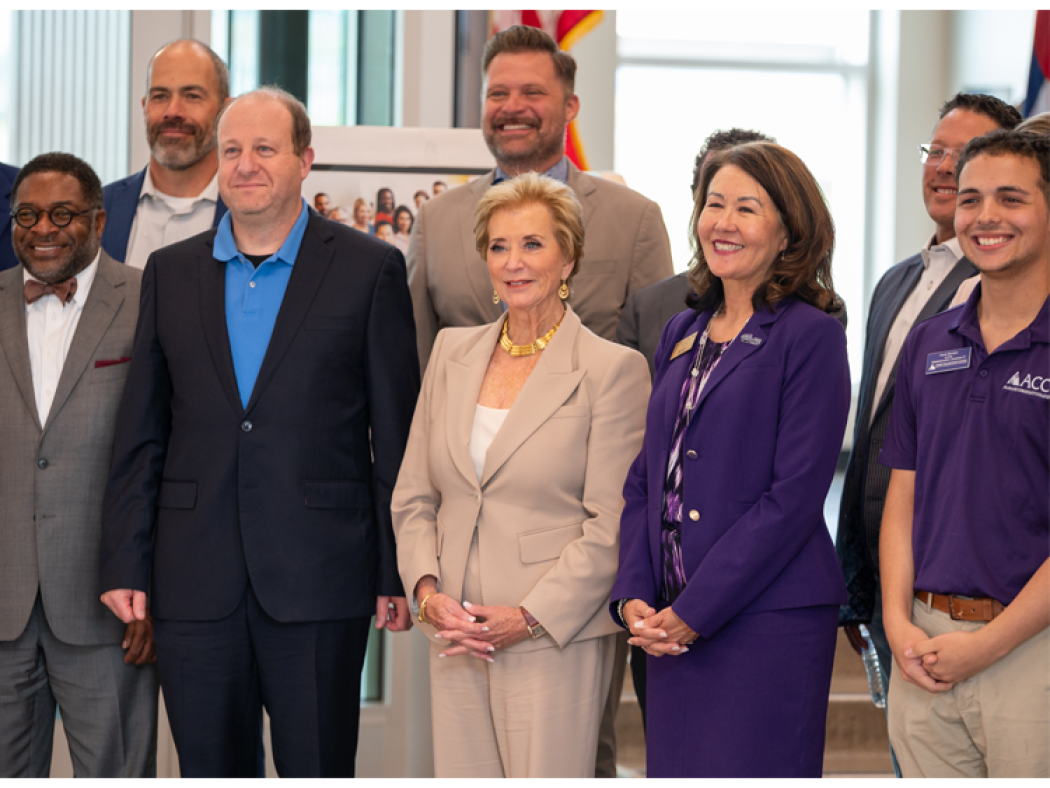 ACC President Stephanie Fujii, Colorado Governor Jared Polis, Secretary of Education Linda McMahon pose for a photo with alumni, educational, industry, and community partners at the Sturm Collaboration Campus at Castle Rock during a visit to showcase The Big Blur and workforce innovation.