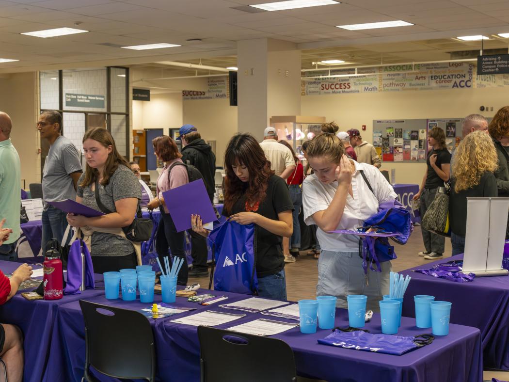 ACC students visiting resource tables at the Littleton Campus Welcome Back BBQ.