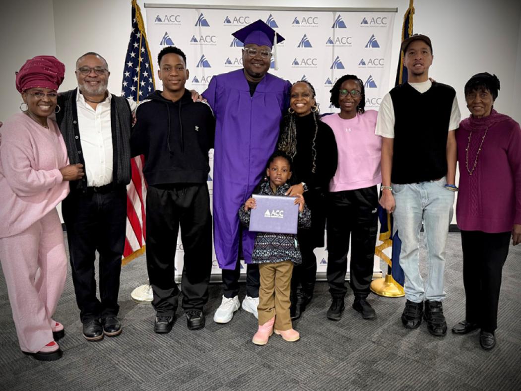 ACC Alum Ayanda Dladla-Ndlovu with his family in the Half Moon at ACC's Littleton Campus.
