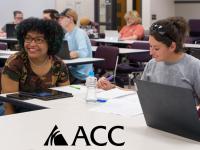 ACC students sitting at tables with laptops and ACC logo.