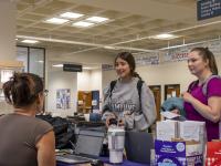 ACC students at a resource table in the student lounge at the Littleton Campus.