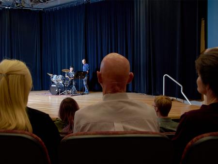 Community members sitting in the audience at ACC's Waring Theater