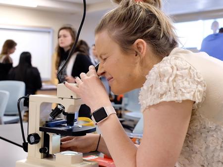 Student looking in microscope