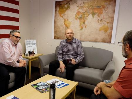 ACC history students sitting in a student lounge at the Littleton Campus.