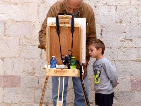 A local boy is curious about the students who are painting in his local village - Italy 2014