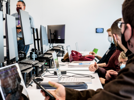 Cybersecurity AAS students in computer classroom at Arapahoe Community College's Sturm Collaboration Campus.