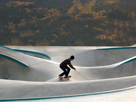 Person skateboarding at skate park (photo by Alexis Salminen)
