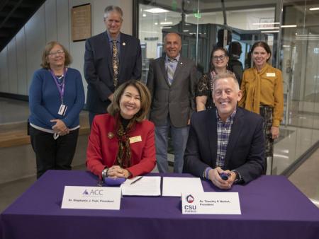 ACC President Stephanie J. Fujii and CSU Pueblo President Timothy P. Mottet, PhD with ACC and CSU Instructional staff members at signing at Sturm Collaboration Campus at Castle Rock.